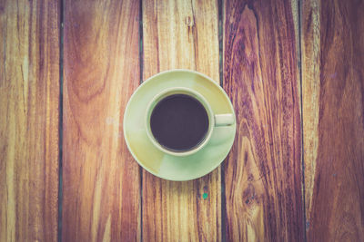 Directly above shot of coffee on wooden table