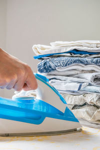 Close-up of woman ironing clothes