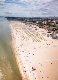 High angle view of crowd on beach against sky