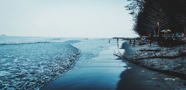 Scenic view of sea against clear sky during winter