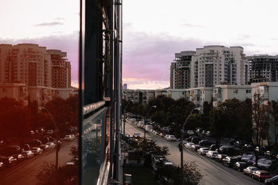 City street by buildings against sky