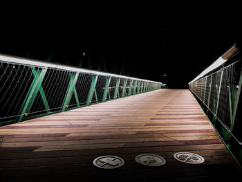 Empty footbridge at night