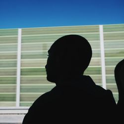 Rear view of man against clear sky