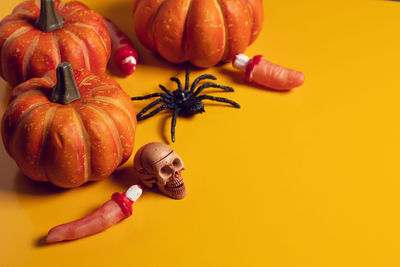 High angle view of pumpkins against orange background