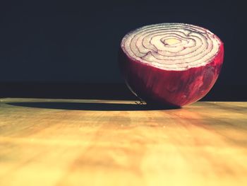 Close-up of onion on cutting board