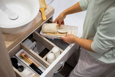 Midsection of man preparing food in kitchen