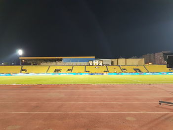 View of soccer field against sky at night