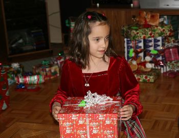 Portrait of a girl with christmas box