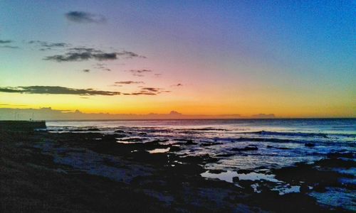 Scenic view of sea against dramatic sky