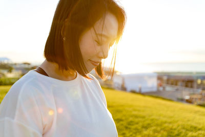 Close-up of beautiful woman against clear sky