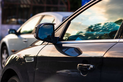 Reflection of car on side-view mirror