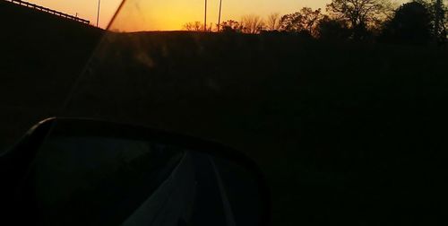 Silhouette trees against sky during sunset