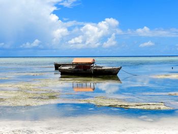 Boat on sea against sky