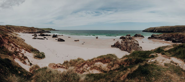 Panoramic view of beach against sky