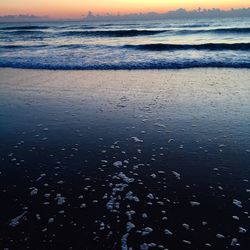 Scenic view of sea at sunset