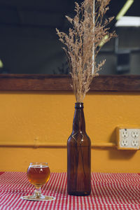 Close-up of glass bottle on table