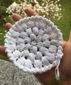 Close-up of hand holding feathers