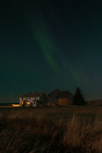 Scenic view of field against sky at night