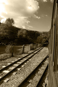 Railroad track seen through train window