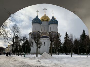 Panoramic shot of building against sky during winter