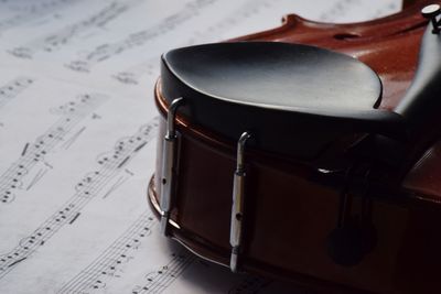 High angle view of violin on sheet music