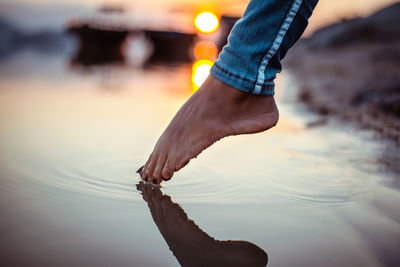 Low section of man legs in sea