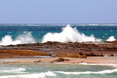 Waves splashing on rocks