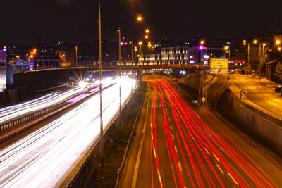 High angle view of light trails on road at night