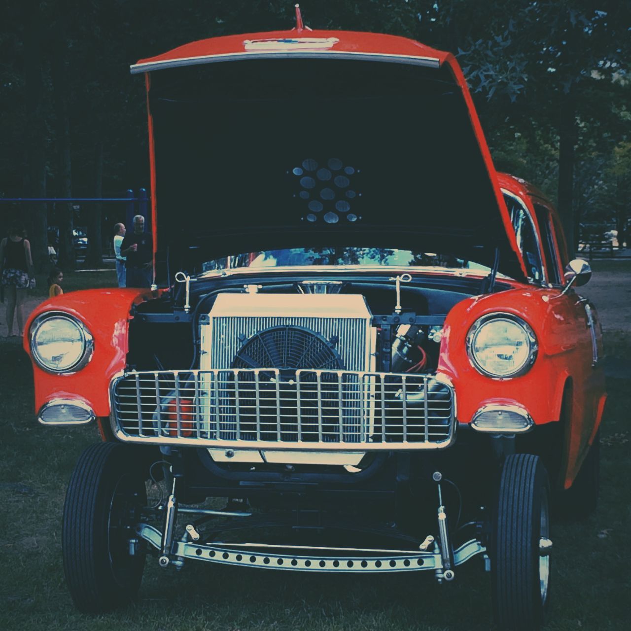 land vehicle, transportation, mode of transport, red, car, old-fashioned, street, outdoors, retro styled, stationary, metal, close-up, day, arts culture and entertainment, headlight, travel, no people, building exterior, protection, vintage car