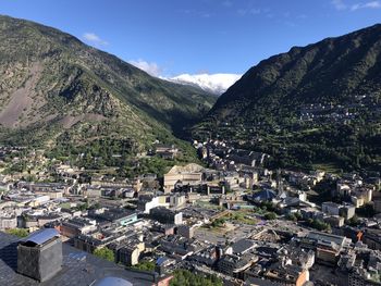 High angle view of townscape and mountains against sky