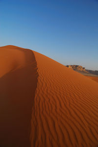 Scenic view of desert against clear sky