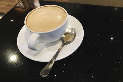 High angle view of coffee cup on table