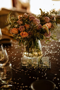 Close-up of roses in glass vase on table