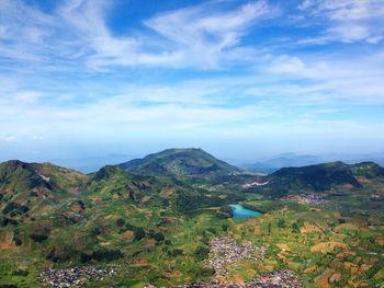 Scenic view of mountains against cloudy sky