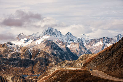 Scenic view of snowcapped mountains against sky