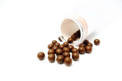 Close-up of coffee beans against white background