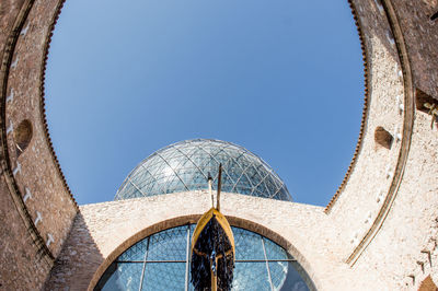 Low angle view of building against clear blue sky