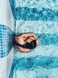 Close-up of a man swimming in pool