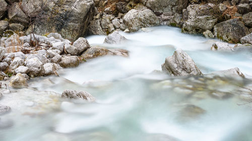 Scenic view of river flowing through rocks