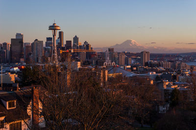 Buildings in city at sunset