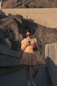 Man standing on mobile phone