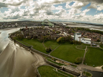 High angle view of city against cloudy sky