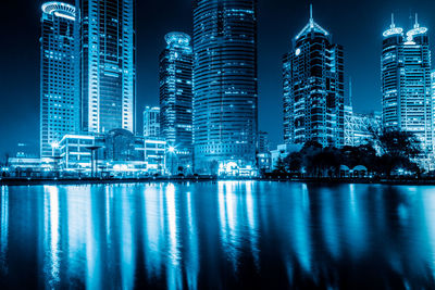 Illuminated buildings in city at night