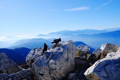 Scenic view of mountains against blue sky