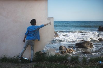 Full length of woman standing in water