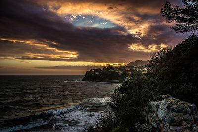 Scenic view of sea against sky during sunset