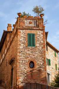 Low angle view of old building against sky