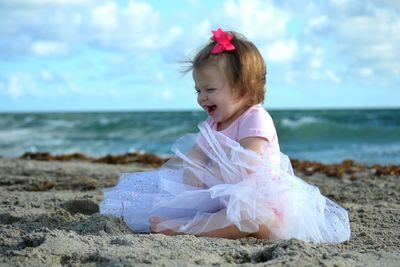 Woman standing on beach