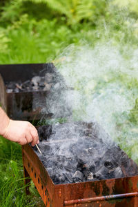 Cropped hand of man preparing food