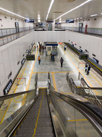 High angle view of people walking at airport